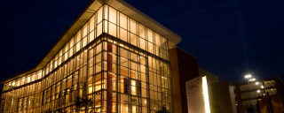 night view of the Duke Performing Arts Center in downtown Durham 